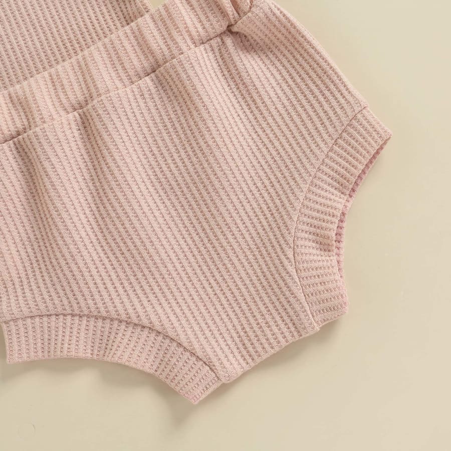 This set includes a long sleeve light weight jumper & matching nappy cover in a Gorgeous Blush colour. Perfect for all year round when styled with pants for the chillier months.