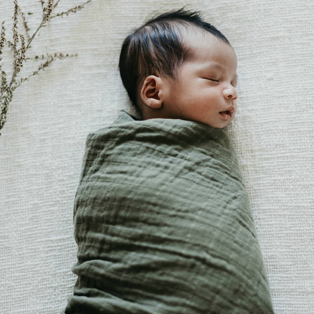 Dusty Olive organic muslin wrap for babies. 