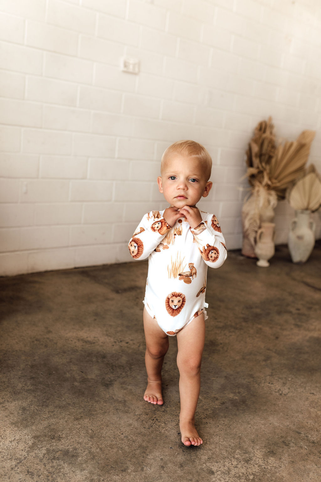 Lion long sleeve bodysuit for babies & toddlers, in a white fabric & adorable lion design