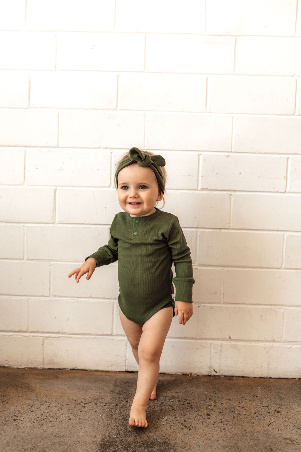 Unisex Olive long sleeve bodysuit for babies & toddlers.