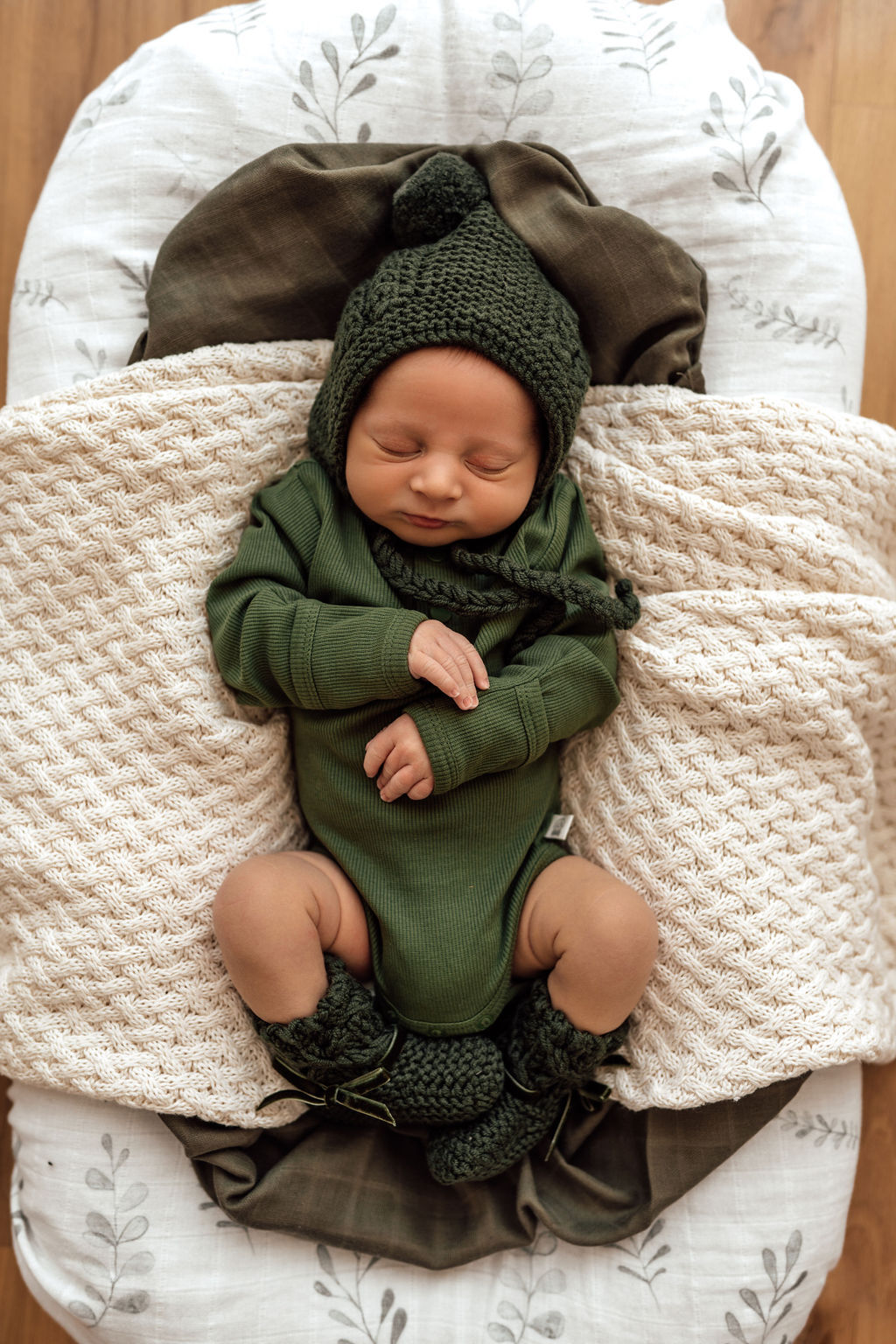 Olive bodysuit paired with merino wool bonnet & booties