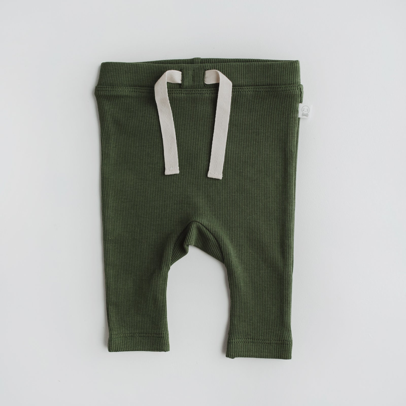 little pants in an olive colour, made from organic rib fabric with a faux drawstring