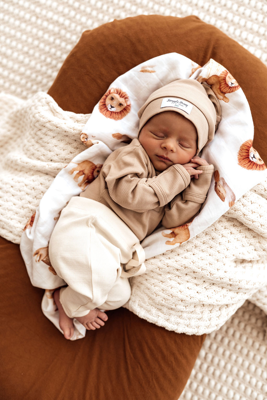 bub dressed in Pebble long sleeve bodysuit, paired with the stretch rib pants in Halo colour