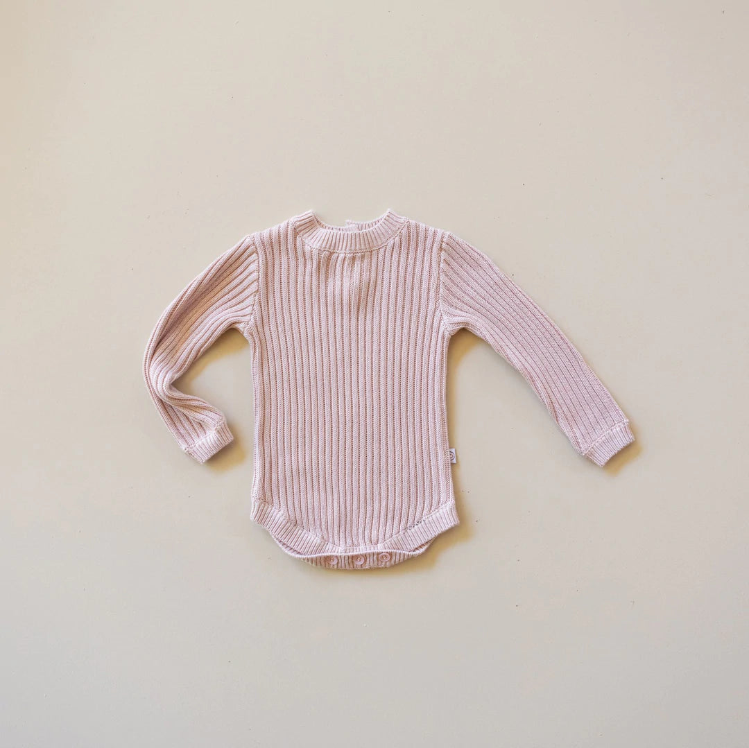 Soft bamboo rib knit baby long sleeve bodysuit in a soft pink colour. 