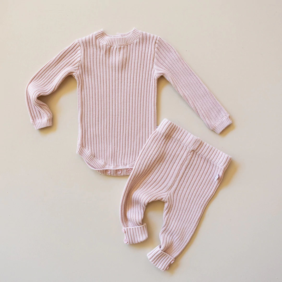 Soft bamboo rib knit baby long sleeve bodysuit in a soft pink colour.