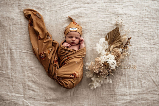 Gorgeous bub wrapped in a caramel colour Jersey wrap in the lion design. 