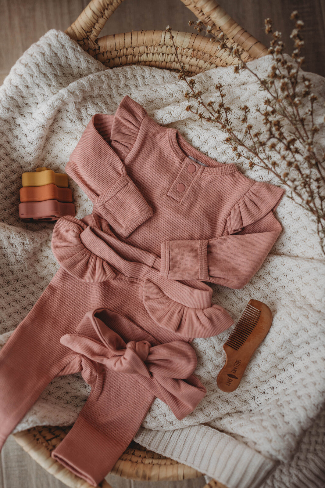 Dusty rose pink baby & toddler body suit in organic rib material, paired with rose pink pants (sold separately)