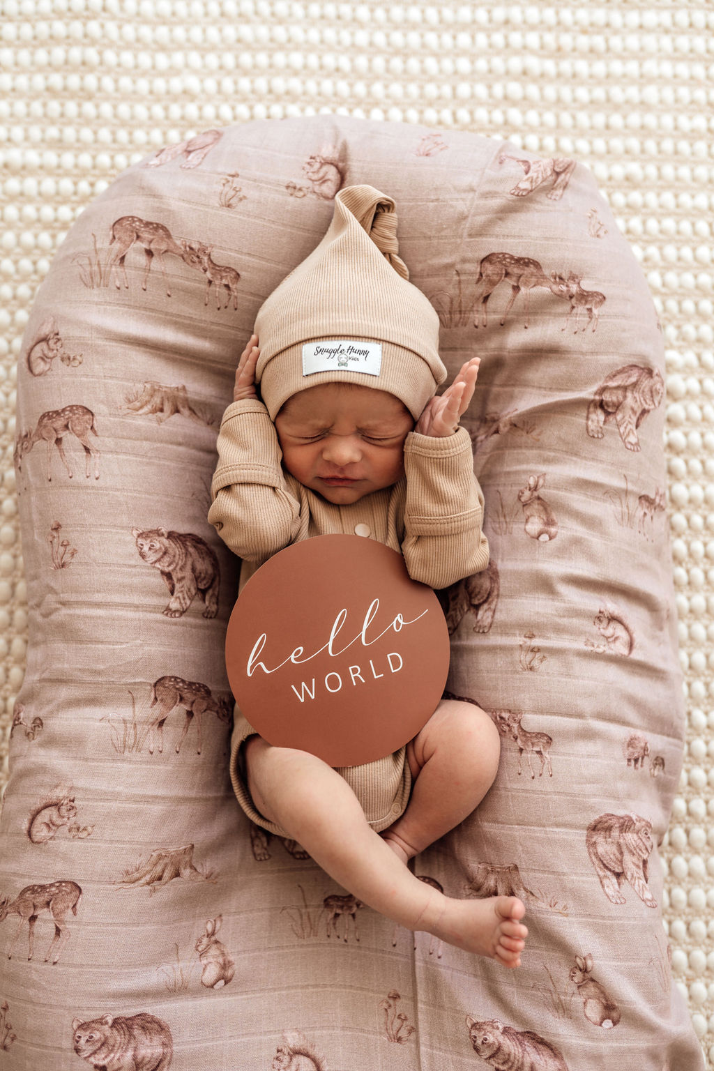 Baby laying on the Woodland Muslin Wrap